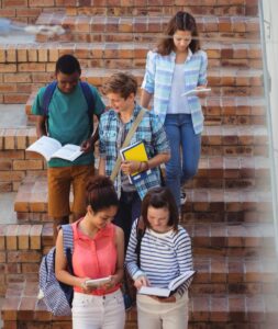students moving down staircase e1669189513465